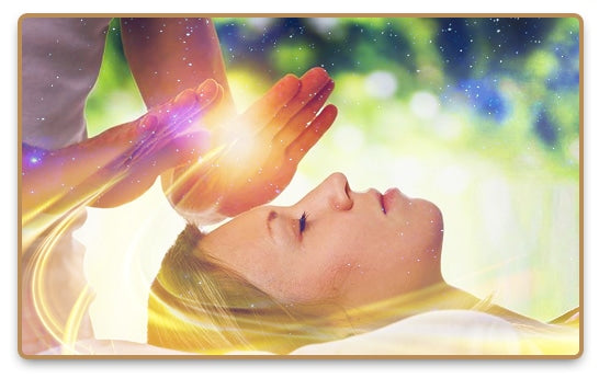 Energy Healing with hands on a laying women