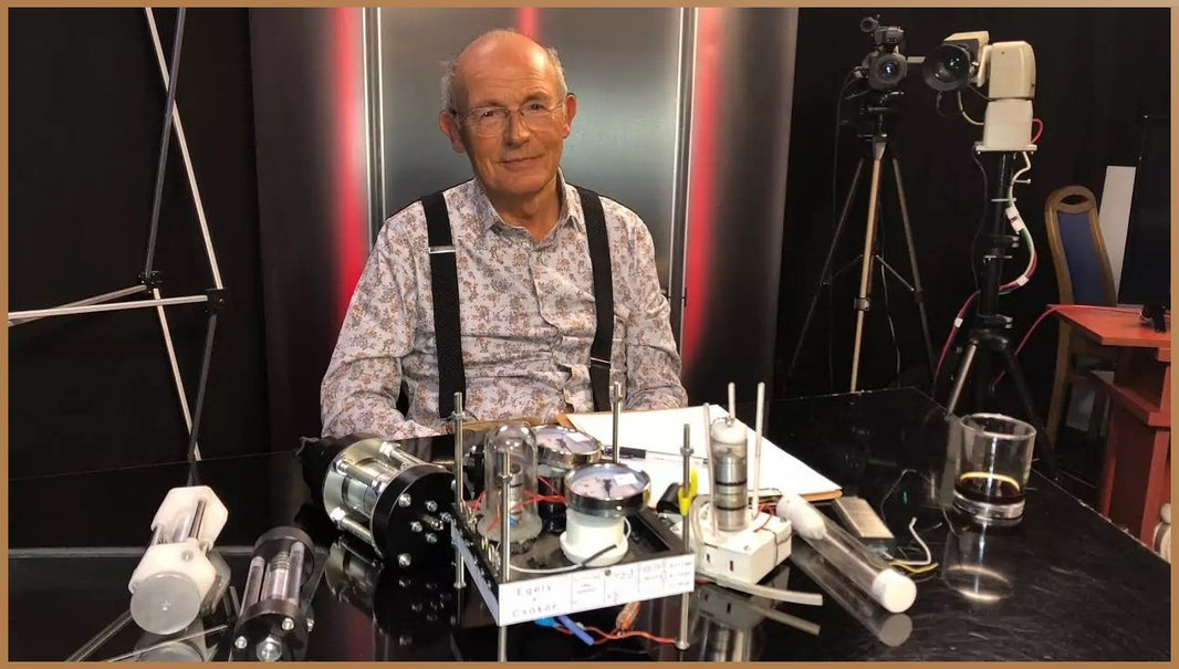 Dr. George Egely in a TV studio with experimental devices aimed at detecting and understanding life energy, a concept often overlooked by conventional science.