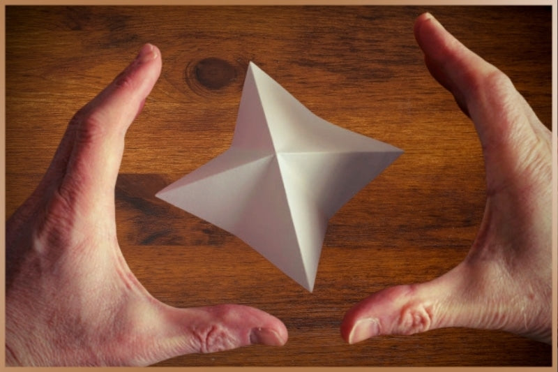 Hands around a rotating, spinning psi wheel